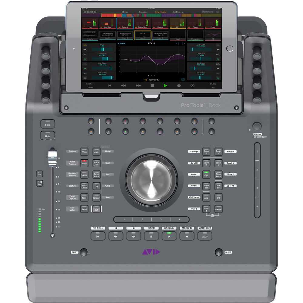 Avid Dock compact touchscreen control surface on mixing desk next to studio monitor — view 2
