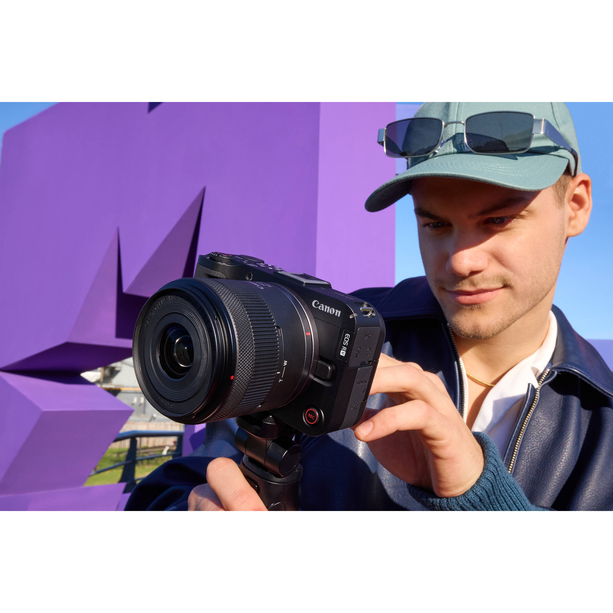 Canon EOS R50 V mirrorless camera with 14-30mm lens, front view — view 21