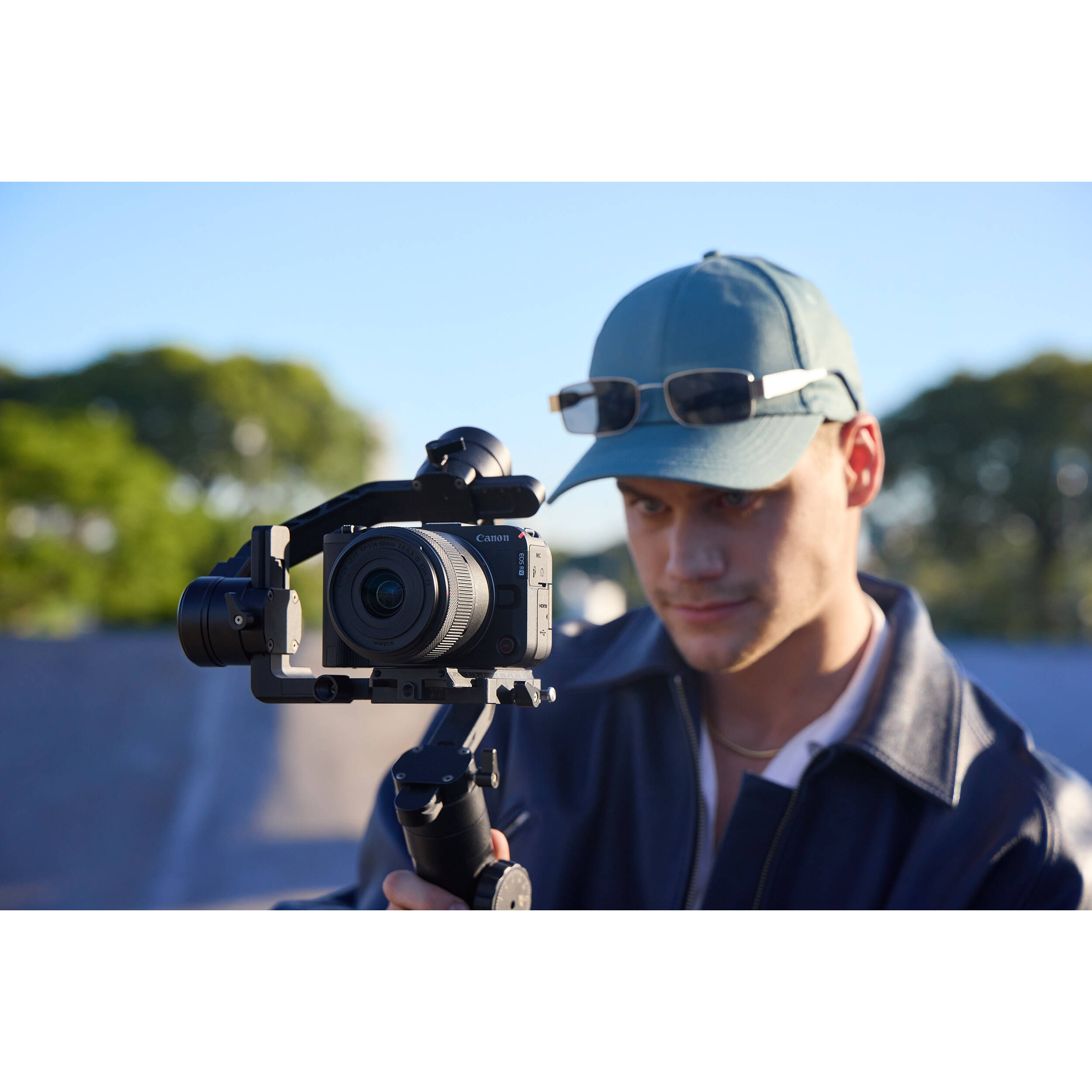 Canon EOS R50 V mirrorless camera with 14-30mm lens, front view — view 23