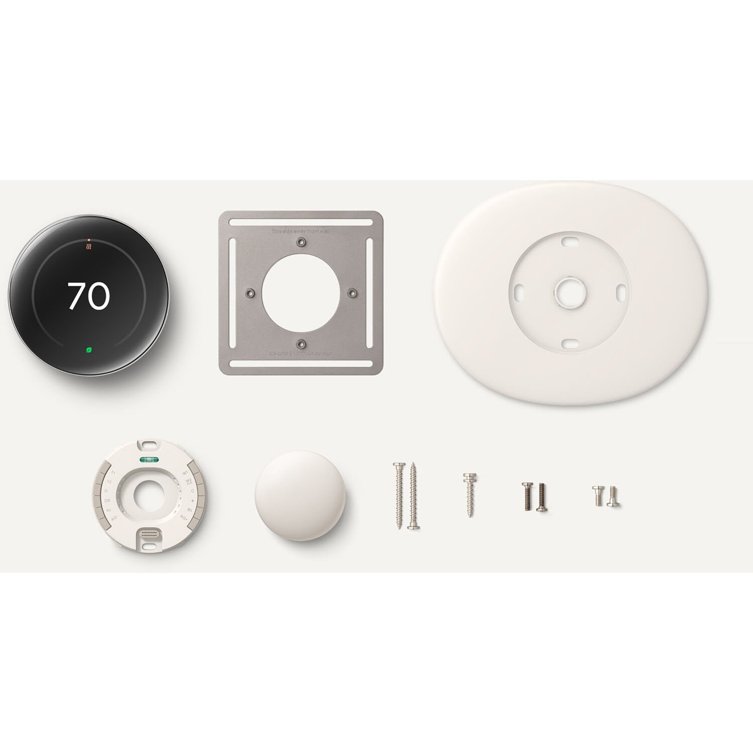 Google Nest Gen 4 Thermostat in Gold finish mounted on a wall — view 4