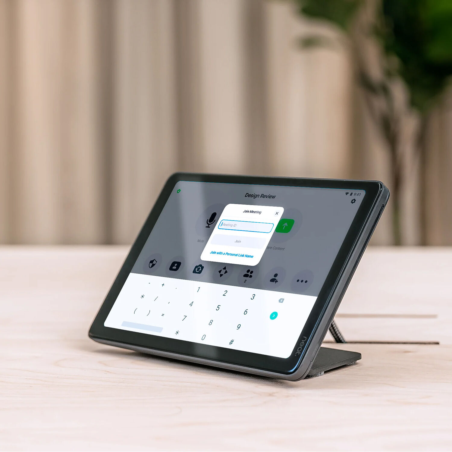 Black desktop stand for Neat Pad in a professional workspace — view 4
